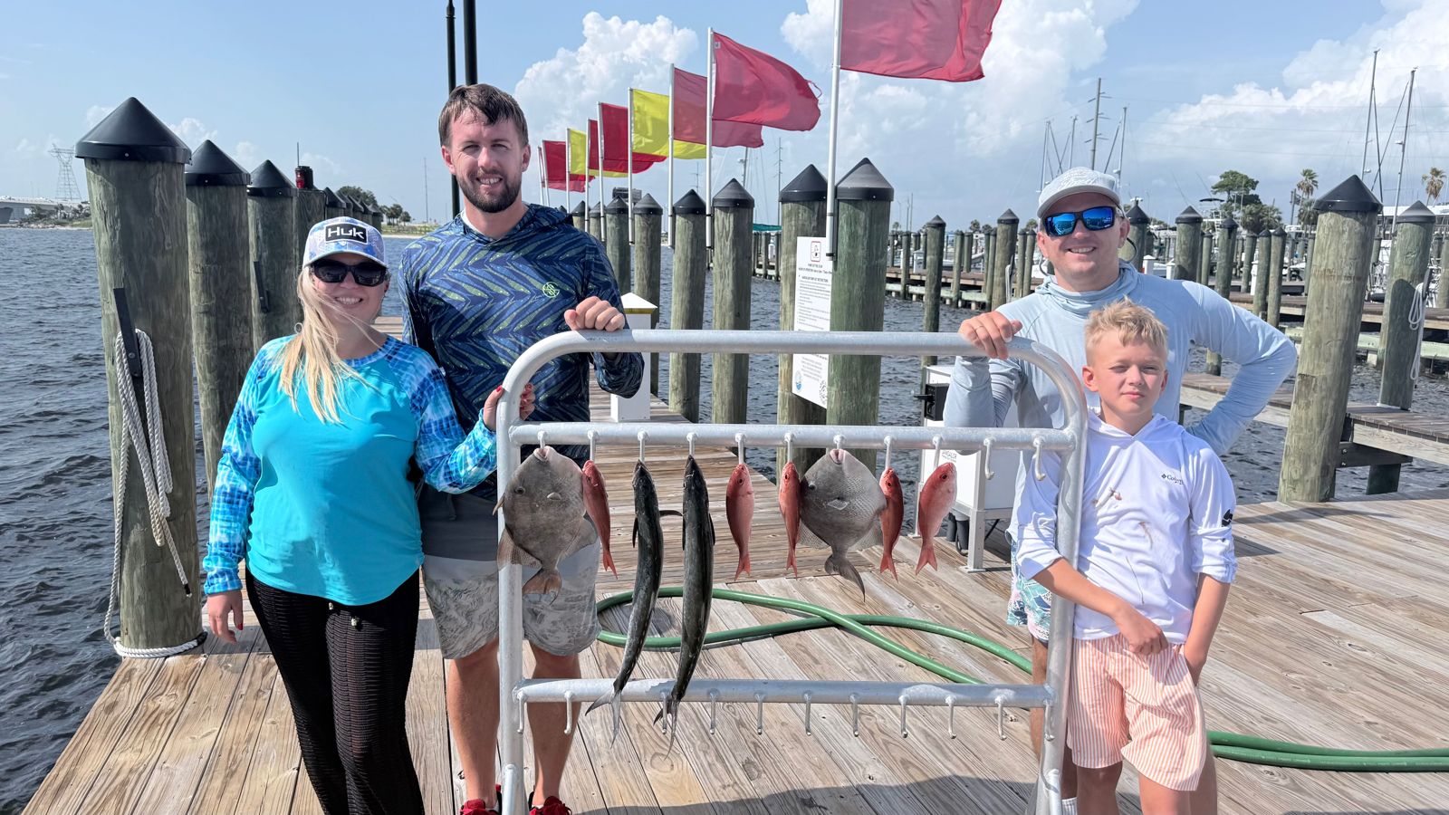 Fishing catch display showing Grey Triggerfish and other species on Panama City FL dock